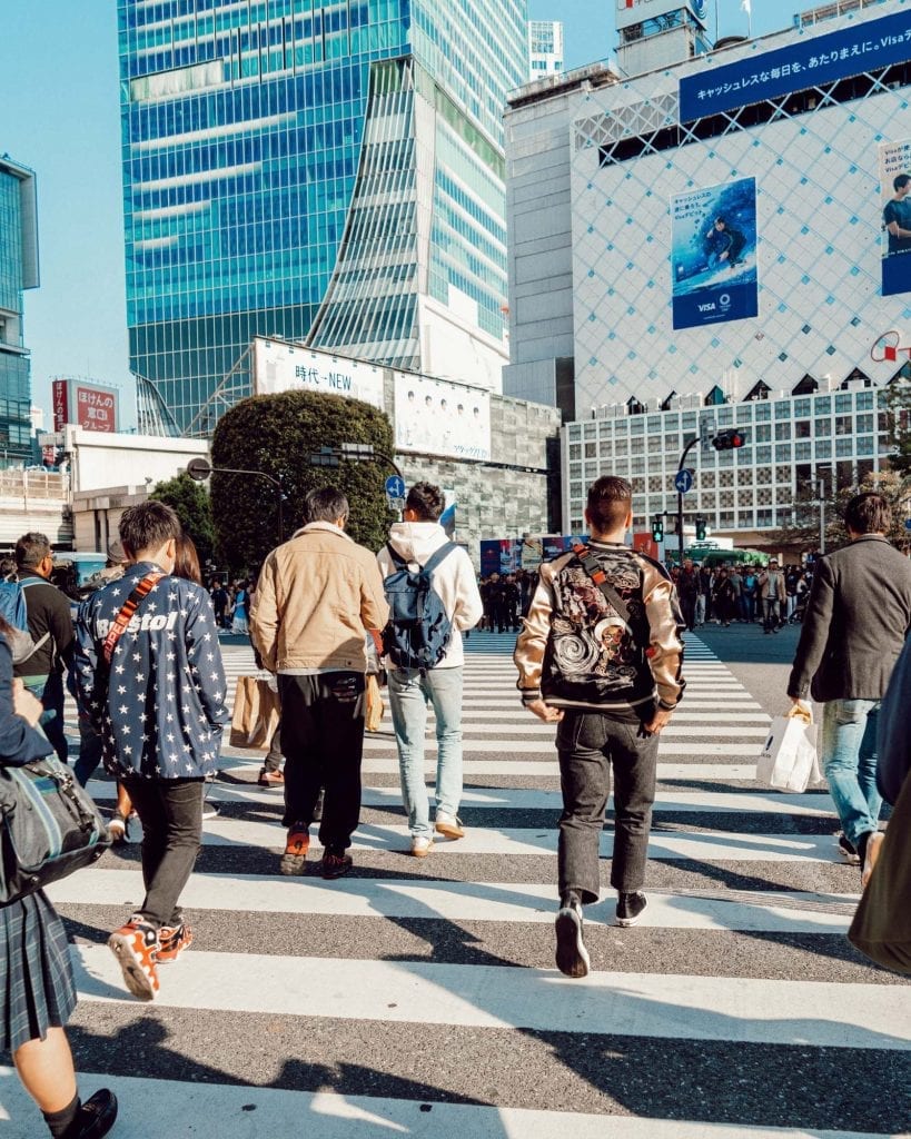 Kyle Legg running into the Shibuya Crossing in Tokyo